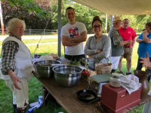 Cooking utensils on table in front of volunteers