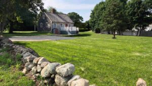 Akin House from behind with a large grassy area